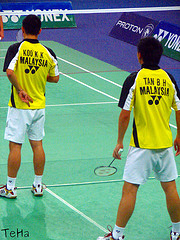 Badminton Doubles Players serving: Koo Kien Keat / Tan Boon Heong Badminton Doubles Players serving: Koo Kien Keat / Tan Boon Heong